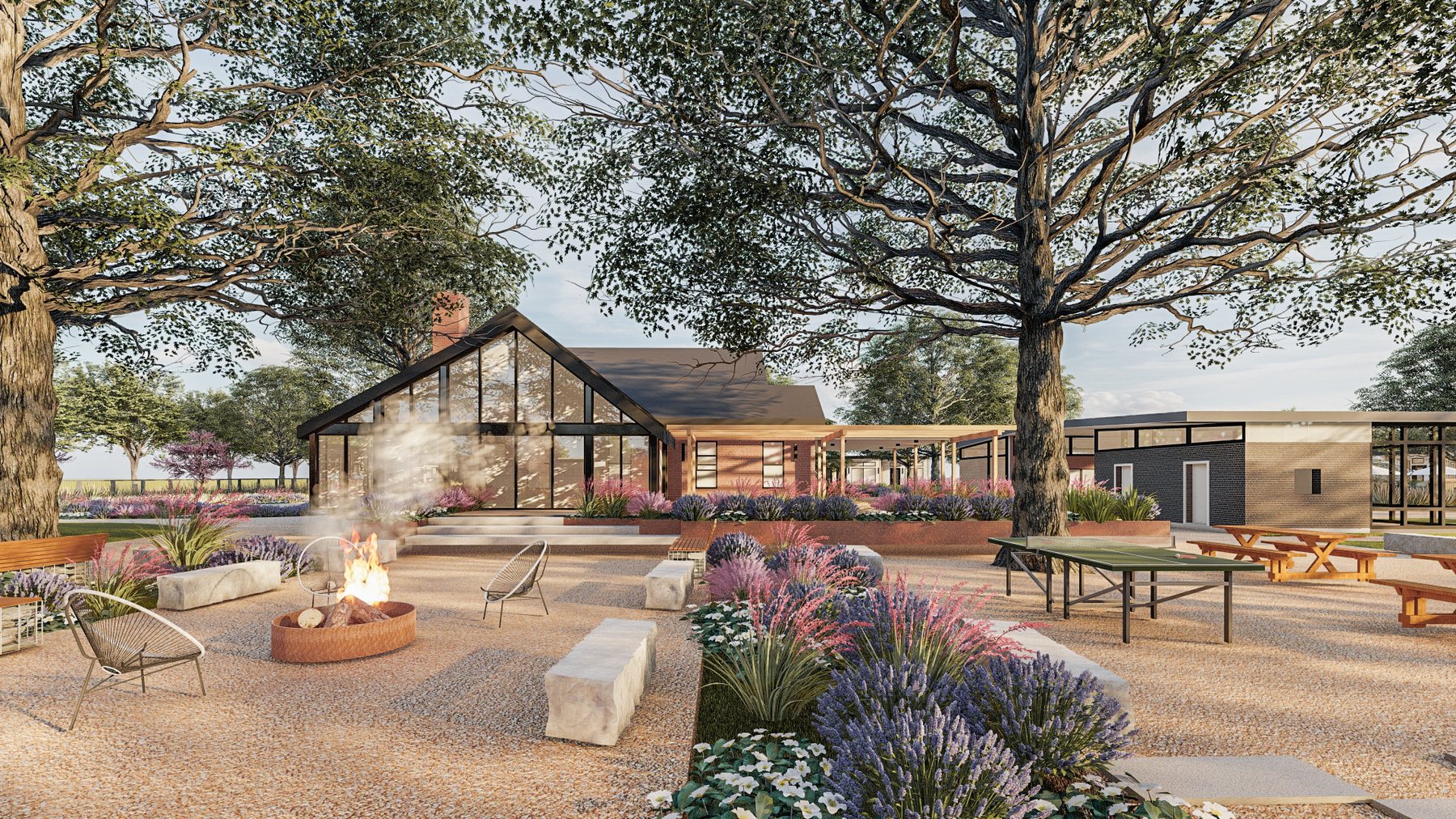 rendering: gravel courtyard with a fire pit, glass-gabled building beyond
