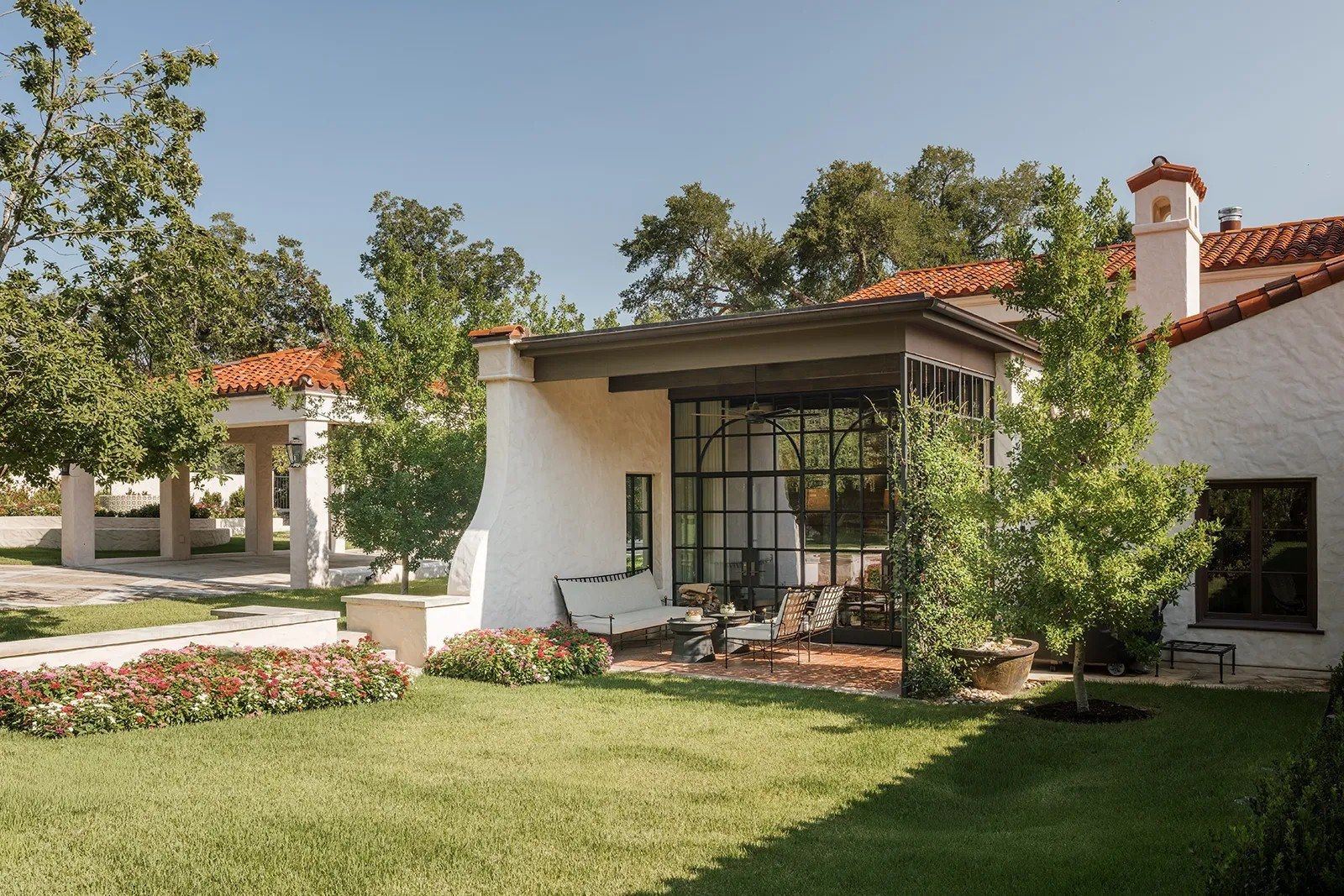 the steel-framed addition opening onto the lawn